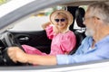 Smiling senior couple friends going summer vacation by car Royalty Free Stock Photo