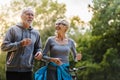 Smiling senior couple jogging in the park Royalty Free Stock Photo