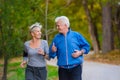 Smiling senior couple jogging in the park Royalty Free Stock Photo