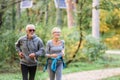 Smiling senior couple jogging in the park