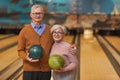 Smiling Senior Couple Posing at Bowling Alley Royalty Free Stock Photo