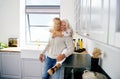 Smiling senior couple sharing a moment in their kitchen Royalty Free Stock Photo
