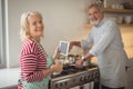 Smiling senior couple standing in kitchen Royalty Free Stock Photo