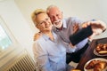 Senior couple taking selfie at home Royalty Free Stock Photo