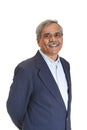 Smiling Senior Indian businessman or executive in a light blue shirt and dark blue suit Royalty Free Stock Photo