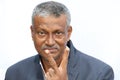 Smiling senior Indian man portrait showing victory sign on white background. Royalty Free Stock Photo