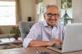Happy smiling old man with laptop Royalty Free Stock Photo