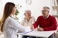 Smiling senior man patient shakes hands with doctor Royalty Free Stock Photo