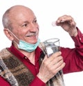 Smiling senior man taking a dietary supplement Royalty Free Stock Photo