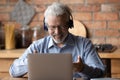 Smiling senior man talk on video call on laptop Royalty Free Stock Photo