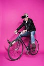 Smiling senior man wearing virtual reality headset and riding bicycle Royalty Free Stock Photo