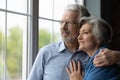 Happy mature couple look in distance dreaming Royalty Free Stock Photo