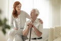 Smiling senior man with walking stick and his happy granddaughte Royalty Free Stock Photo