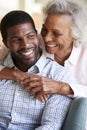 Smiling Senior Mother Hugging Adult Son At Home Royalty Free Stock Photo