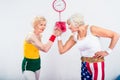 smiling senior sportswomen wrestling and looking at each other Royalty Free Stock Photo
