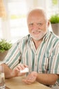 Smiling senior taking medication Royalty Free Stock Photo