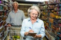 Smiling senior woman checking list Royalty Free Stock Photo