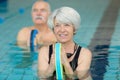 Smiling senior woman doing aqua fitness Royalty Free Stock Photo