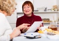 Smiling senior women with documentation Royalty Free Stock Photo