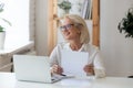 Smiling senior woman look in distance thinking Royalty Free Stock Photo