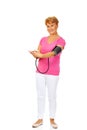 Smiling senior woman measuring blood pressure Royalty Free Stock Photo