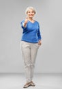 Smiling senior woman r showing thumbs up Royalty Free Stock Photo