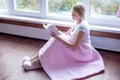 Smiling senior woman reading a book at home Royalty Free Stock Photo