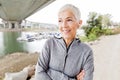 Smiling Senior Woman Relax Listening Music With Earphones After Running Royalty Free Stock Photo