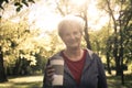 Senior woman in sports clothing standing in park looking Royalty Free Stock Photo