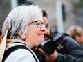 Smiling senior woman - Swiss seniors peacefully protest in front of the European Royalty Free Stock Photo