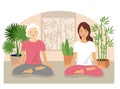 Smiling senior woman and a young woman meditating relaxing. Mother and daughter or Granny and granddaughter in yoga pose