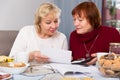 Smiling senior women with documentation Royalty Free Stock Photo