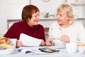 Smiling senior women with documentation Royalty Free Stock Photo