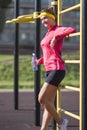 Smiling Caucasian Female Athlete in Professional Outfit Posing With Water Bottle Royalty Free Stock Photo