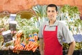 Shopman at the vegetables shop Royalty Free Stock Photo