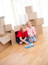 Smiling sibling playing while moving house Royalty Free Stock Photo