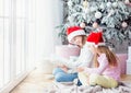 Smiling sisters reading book