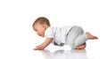 Smiling sly baby boy running away on all fours Royalty Free Stock Photo