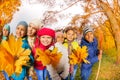 Smiling small children in park with yellow leaves Royalty Free Stock Photo