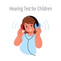 The smiling small girl is wearing headphones and taking a hearing test.Hearing exam for children.