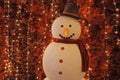 Smiling Snowman with Sparkling Red Color Christmas Decorations in Background Royalty Free Stock Photo