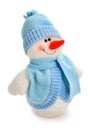 Smiling snowman toy dressed in scarf and cap