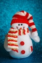 Smiling snowman toy dressed in scarf and cap Royalty Free Stock Photo