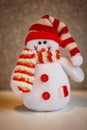 Smiling snowman toy dressed in scarf and cap Royalty Free Stock Photo