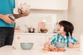 Smiling Son and Father Have Breakfast in Kitchen Royalty Free Stock Photo