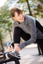 Smiling sport woman tying shoelace Royalty Free Stock Photo