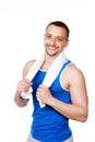 Smiling sportive man with towel standing