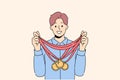 Smiling sportsman with golden medals