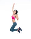 Smiling sporty woman jumping