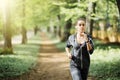 Smiling sporty woman running outdoors in city park Royalty Free Stock Photo